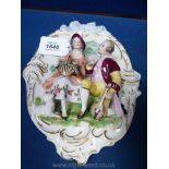 A German (Frankenthal) wall plaque of a Gentleman serenading a lady.