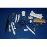 A cased pair of old glasses, miscellaneous bone letter openers, whistle, large buckle etc.