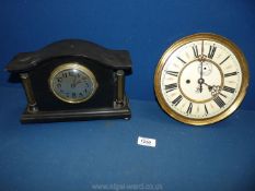 A small black marble Mantle Clock with brass cornithian columns, 7" high approx.