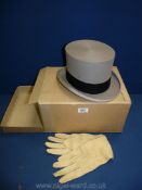 A grey top hat by Austin Reed, and a pair of cream leather gloves in original box, no hat size seen.