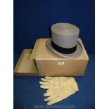 A grey top hat by Austin Reed, and a pair of cream leather gloves in original box, no hat size seen.