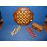 A boxed Chess Set with marquetry chess board (17 3/4'' long x 16 1/14'' wide)