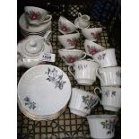 A 1960's child's tea set with six cups and saucers, teapot, milk jug and sugar bowl.