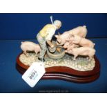 A Border Fine Arts figure group of Pig Feeding Time, boxed, 5 1/4'' tall.