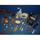 A quantity of miscellanea including two wooden oriental figures, cased whistle, RAF badges,