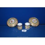 An interesting pair of hard paste coffee cans and saucers,