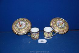 An interesting pair of hard paste coffee cans and saucers,