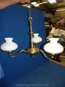 A brass tree branch Electrolier with oil lamp style shades.