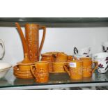 A Portmeirion 'Totem' design, brown Coffee set comprising coffee pot with lid, six cups and saucers,