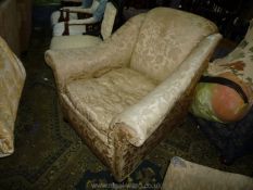 A circa 1900 Armchair of elegant form upholstered in pale gold coloured satin like shadow pattern