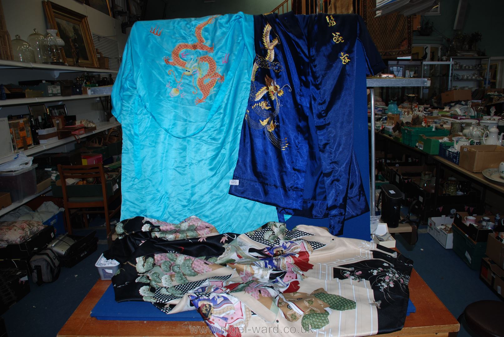 Three Kimonos, one navy, one black and one turquoise, two having hand embroidery.