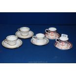 Five coffee cans and saucers including Royal Crown Derby (some wear to gold rim),