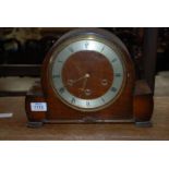 A Smiths domed Walnut type finished cased three train movement Mantel Clock,