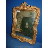 A rectangular ornate plaster Mirror with leaf detail, 20'' x 14'',