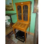 An arts and crafts type Bureau Bookcase of compact dimensions,