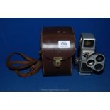 A G.B. Bell & Howell Autoset turret 8mm Cine Camera with rotating lenses and original case.