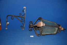 An old wrought iron Porch lantern and bracket.