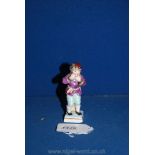 A fine small porcelain figure of a boy, representing the month of January,