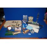 A wooden baton, British Eagle G-AOCC model aeroplane, playing cards, small photograph frame,