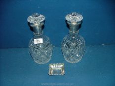 A pair of silver necked Decanters, London 1938 and a pierced silver bon bon Dish, London 1925.