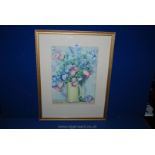 A framed and mounted Watercolour of a still life depicting a yellow tankard with flowers,