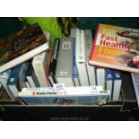 A box of books to include Readers Digest, World Atlas, Chronicles of the year 1989 etc.