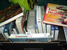 A box of books to include Readers Digest, World Atlas, Chronicles of the year 1989 etc.