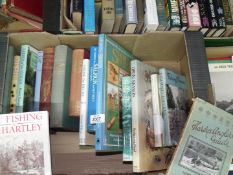 A box of books on fishing and hunting to include J.R. Hartley and Hardy's anglers guide etc.