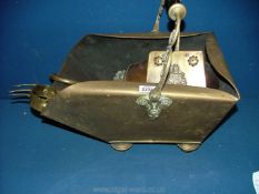 A brass Coal Scuttle with fire irons, shovel and chestnut roaster.