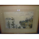 A framed and mounted watercolour of a spruce lined lake scene with mountains and island,