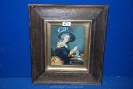 A wooden framed print of an elegant lady sitting at her writing desk.
