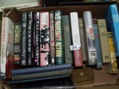 A box of books on military topics.