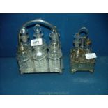 Two 1930's plated condiment stands with non-matching glass bottles, one by Walker & Hall.
