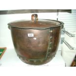 A large riveted copper Pan with lid.