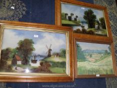 A pair of Maple framed Oil paintings depicting a castle on river bank with a figure by a cottage,
