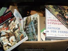 A box of books on royalty development and Psychology etc.