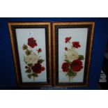 Two pictures with red and cream glass painted flowers.