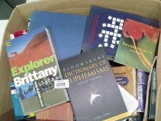 A box of books to include crossword companions, dictionary of euphemisms, dictionaries etc.