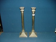 A pair of large Brass Candlesticks with square tops, 18 3/4'' tall.
