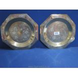 A pair of heavily chased antique Brass octagonal Dishes with silver inlay, 25 cm.