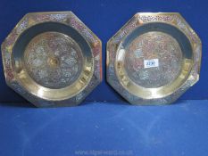 A pair of heavily chased antique Brass octagonal Dishes with silver inlay, 25 cm.