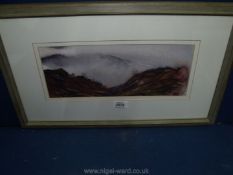 A framed and mounted Watercolour of a Mountain scene indistinctly signed to the right.