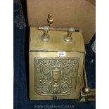 A brass coal Scuttle with liner and shovel.