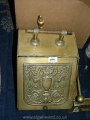 A brass coal Scuttle with liner and shovel.