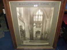 A wooden framed Kodak advertising Photo of the inside of a cathedral,