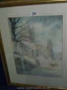 A framed and mounted Watercolour depicting Hereford Cathedral in the snow, no signature visible.