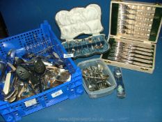 A quantity of miscellaneous cutlery, cased set of teaspoons and sugar tongs,