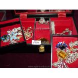 A black Musical Jewellery case with ballerina, containing miscellaneous costume jewellery, brooches,