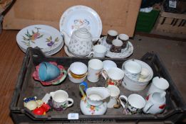 A Royal Worcester Evesham worn dinner plates, coffee mugs etc.