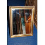 A modern gilt framed mirror. 22" x 28".